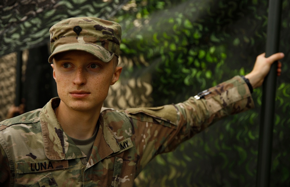 205th MCGA assembles camouflage netting