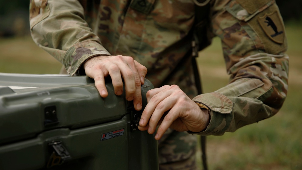 205th MCGA assembles camouflage netting