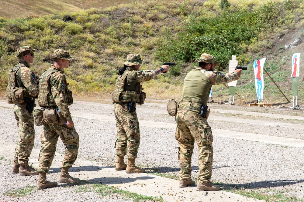 Hungarian soldiers practice firing at pistol range