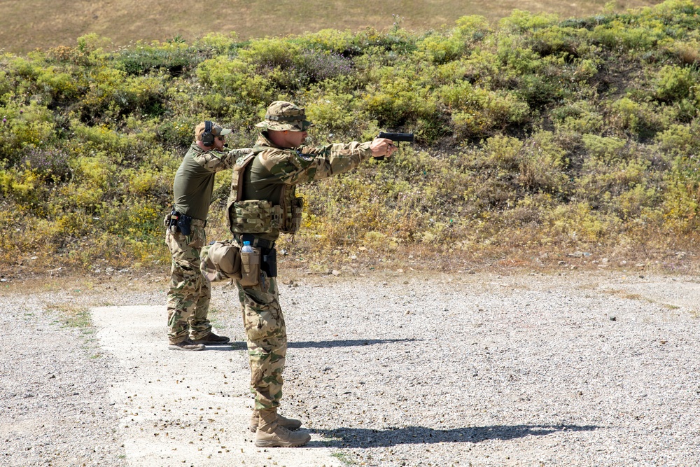 Hungarian soldiers practice firing at pistol range