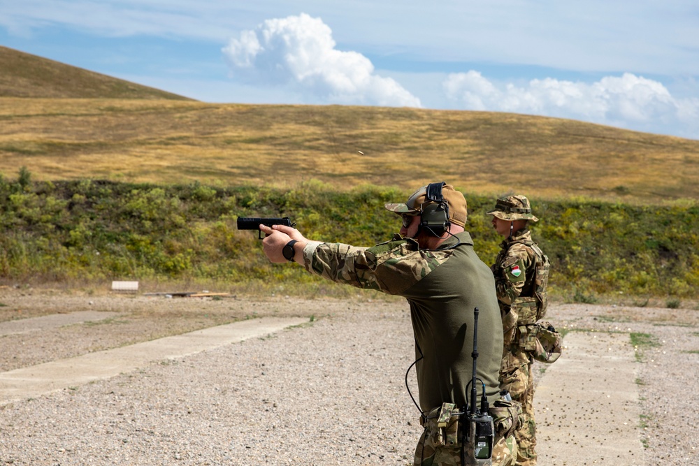 Hungarian soldiers practice firing at pistol range