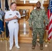 Capt. Craig Mattingly Awards Aviation Electricians Mate 1st Class Steven Jeffries Navy and Marine Corps. Commendation Medal