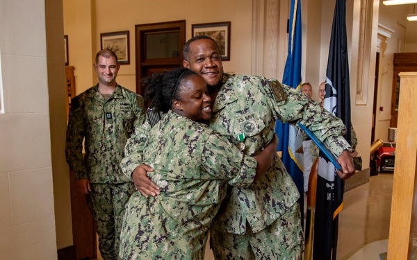 Capt. Craig Mattingly Awards Aviation Electricians Mate 1st Class Steven Jeffries Navy and Marine Corps. Commendation Medal