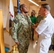 Capt. Craig Mattingly Awards Aviation Electricians Mate 1st Class Steven Jeffries Navy and Marine Corps. Commendation Medal