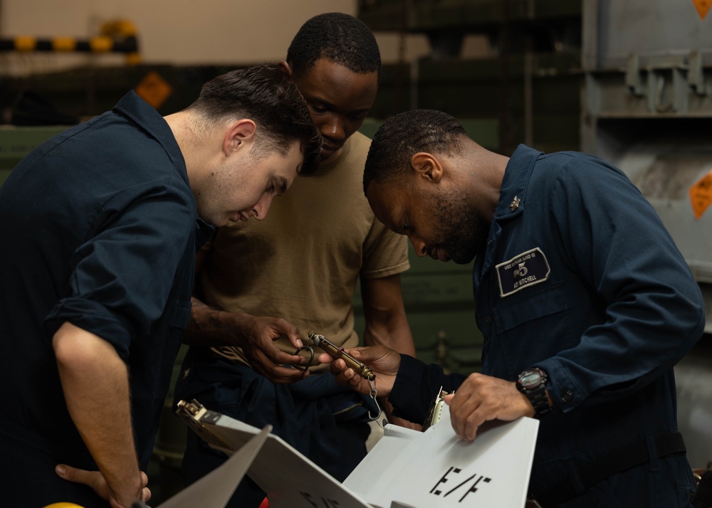 USS Bataan Sailors assemble a missile