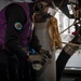Sailor takes fuel samples during a replenishment at sea