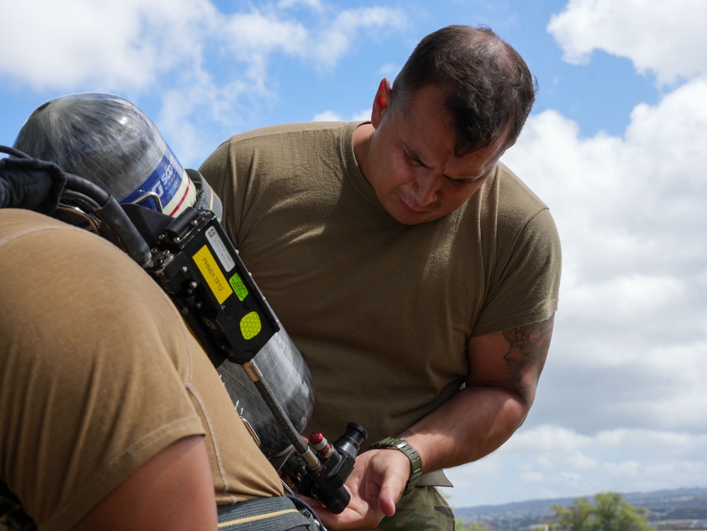 JTF-RH roving security and fire watch team members conduct SCBA training on Ford Island