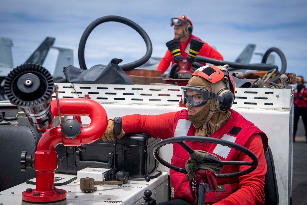 Sailor Aboard USS Carl Vinson (CVN 70) Participate in a Crash and Salvage Drill