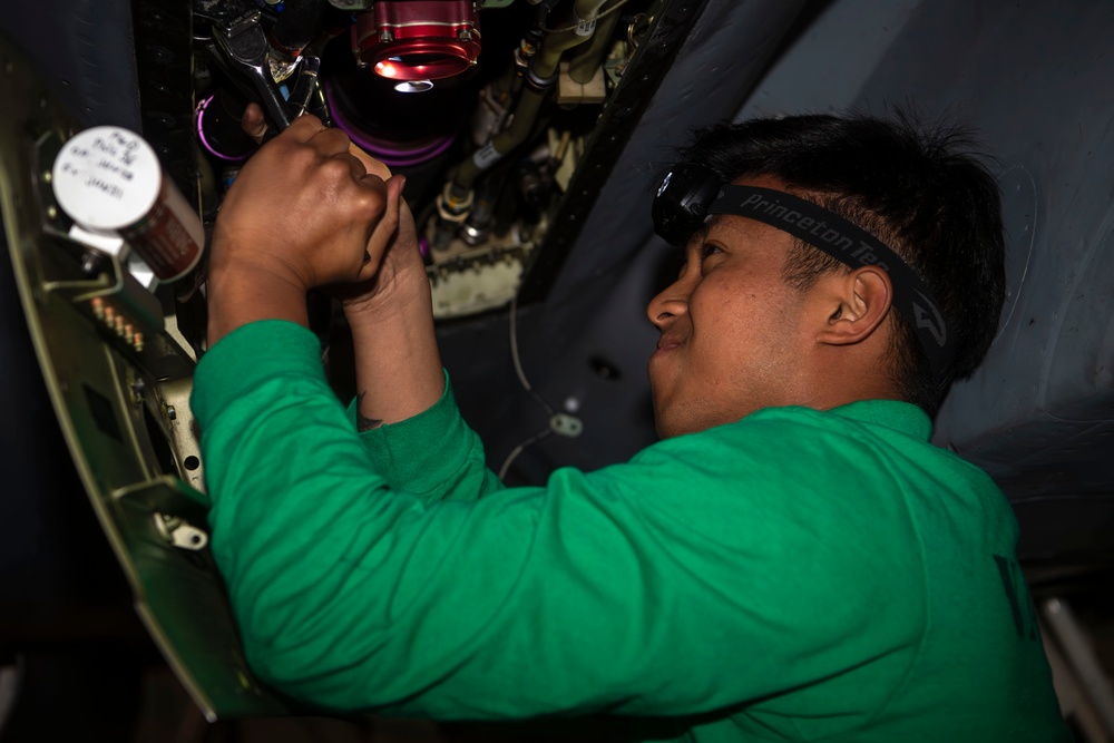 Sailor Aboard USS Carl Vinson (CVN 70) Perform Maintenance