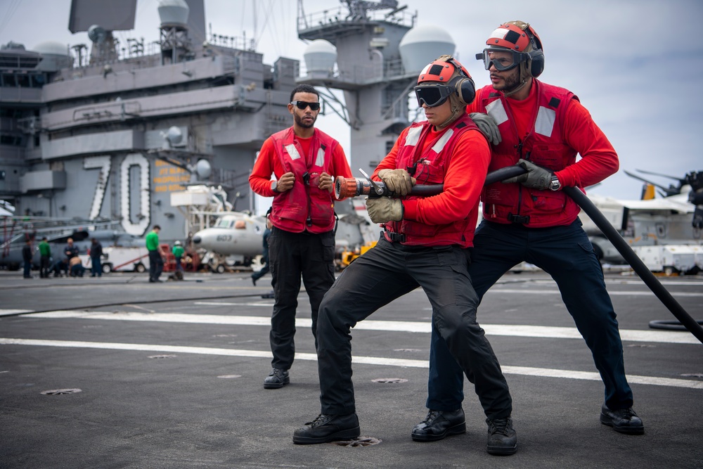 Sailor Aboard USS Carl Vinson (CVN 70) Participate in a Crash and Salvage Drill