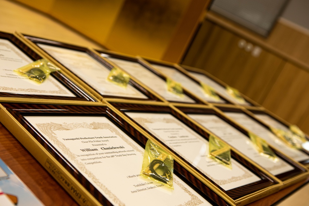 Present the Awards - SAC presents Yamaguchi Truck Association drawing awards earned in school-wide art contest