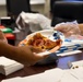 USO Foster provides pizza for Marines with CLR-3 for helping Camp Foster recover from Typhoon Khanun