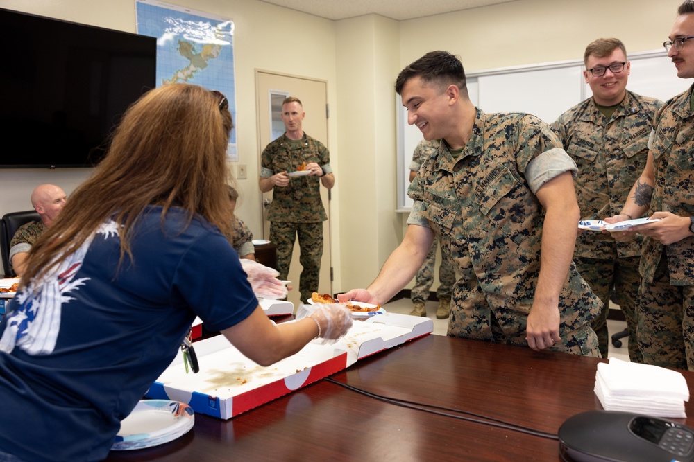 USO Foster provides pizza for Marines with CLR-3 for helping Camp Foster recover from Typhoon Khanun
