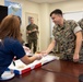 USO Foster provides pizza for Marines with CLR-3 for helping Camp Foster recover from Typhoon Khanun