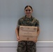 U.S. Sailor with 2nd Marine Aircraft Wing is awarded the Junior Aerospace Medicine Technician of the Year Award