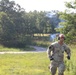 Officer candidate school instructor marks landing zone with green smoke