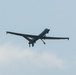 MQ-9 Reaper flies overhead