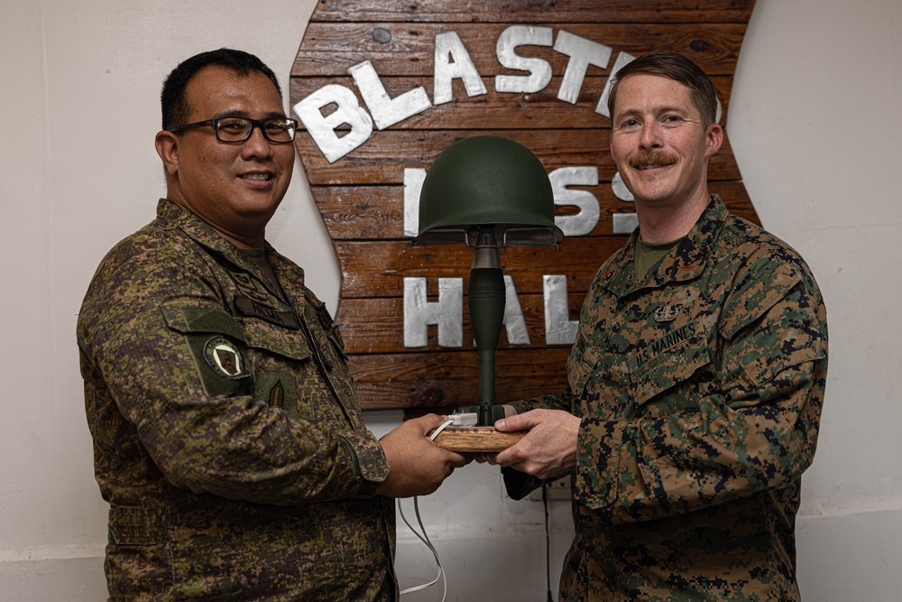 U.S. Marines with Explosive Ordnance Disposal Company, 9th Engineer Support Battalion, thanks Philippine Army Explosive Ordnance Disposal Battalion, Army Support Command.