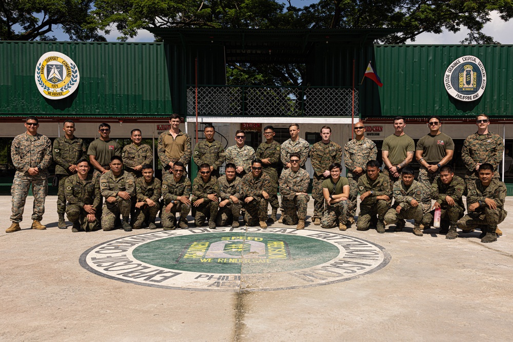 U.S. Marines with Explosive Ordnance Disposal Company, 9th Engineer Support Battalion, thanks Philippine Army Explosive Ordnance Disposal Battalion, Army Support Command.