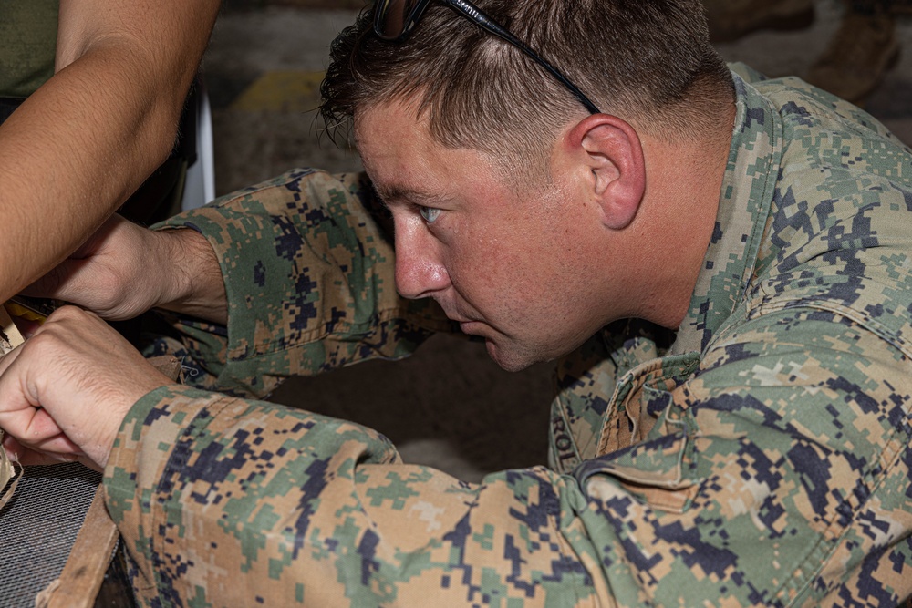 U.S. Marines with Explosive Ordnance Disposal Company, 9th Engineer Support Battalion and Philippine Army Explosive Ordnance Disposal Battalion, Army Support Command, participate in EOD simulations.