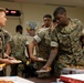 USO serves pizza to MWSS-172 for their efforts | Typhoon Khanun