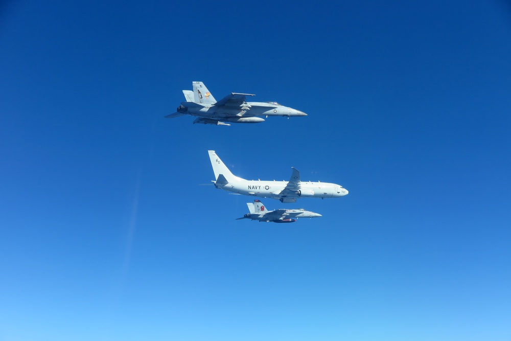 &quot;Tomcatters&quot; and &quot;Golden Warriors&quot; escort P-8A