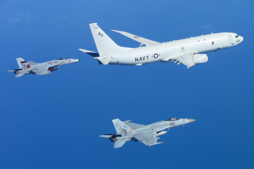 &quot;Tomcatters&quot; and &quot;Golden Warriors&quot; escort P-8A