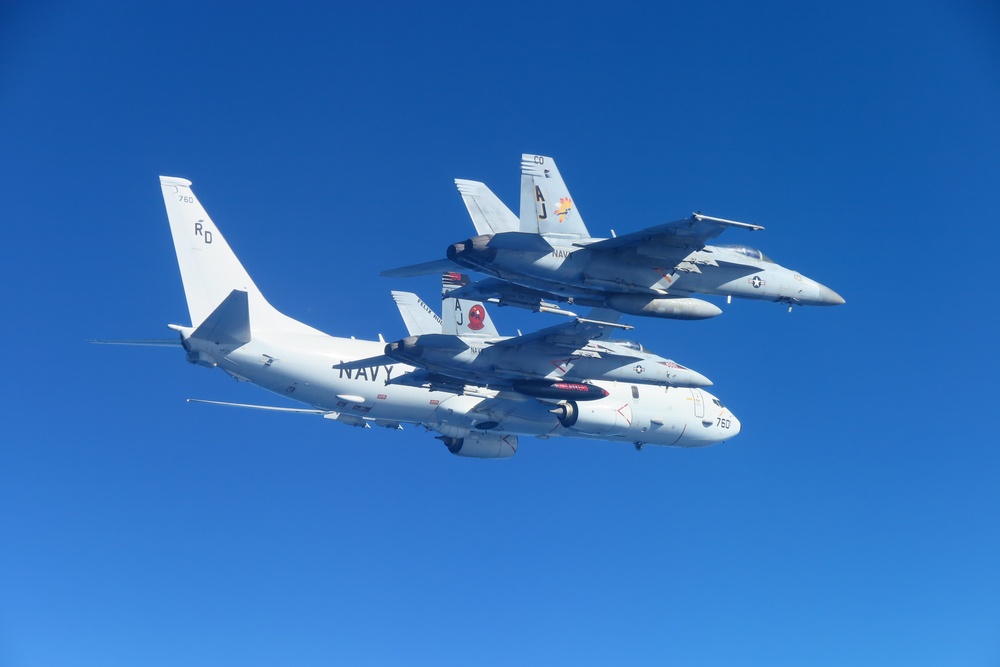 &quot;Tomcatters&quot; and &quot;Golden Warriors&quot; escort P-8A