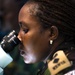 Lt. Col. Julianna Munyao, Kenya Defence Forces, identifies different mosquito species through a microscope at the Africa Malaria Task Force (AMTF) conference, July 18, 2023.