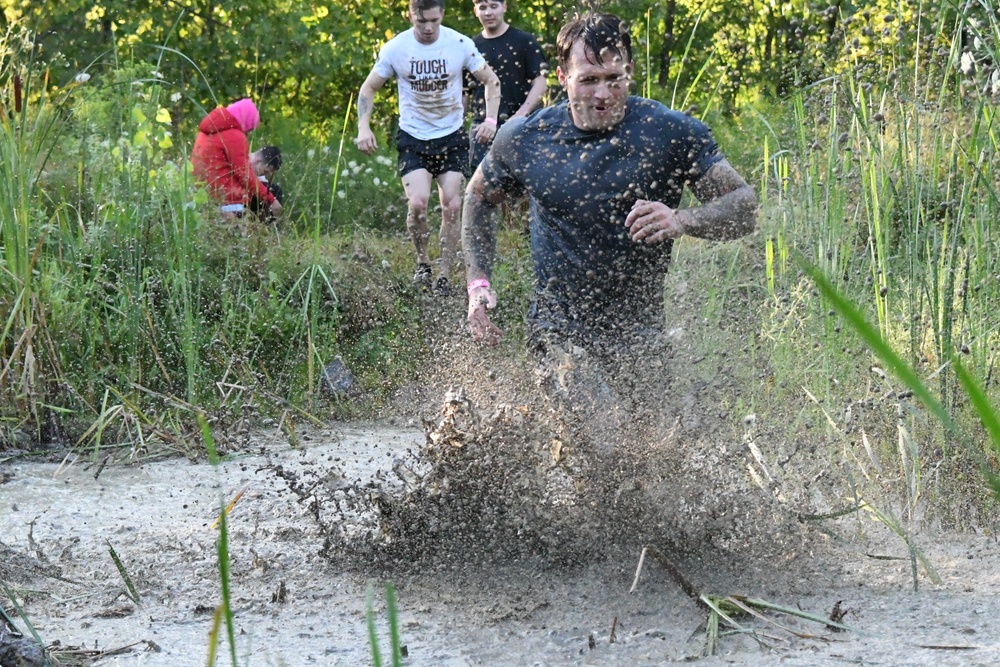 Ten years and still muddy: Fort Drum community members dive into Mountain Mudder