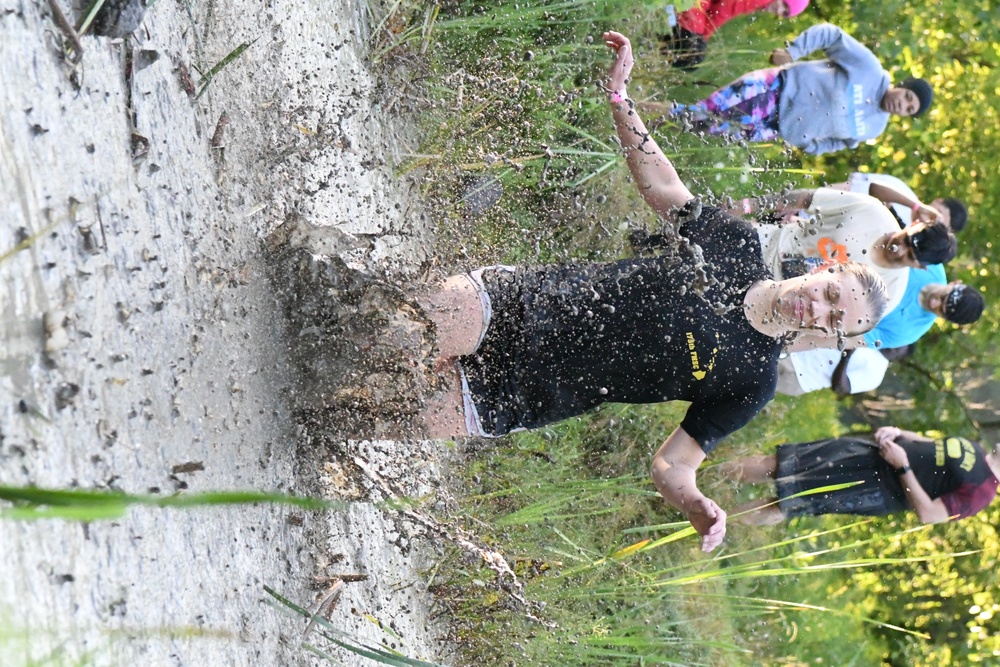 Ten years and still muddy: Fort Drum community members dive into Mountain Mudder