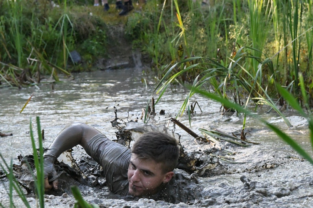 Ten years and still muddy: Fort Drum community members dive into Mountain Mudder