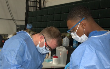 Dentist assists in Guam Wellness IRT