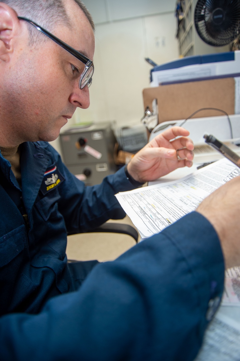 USS Ronald Reagan (CVN 76) Sailors work in the post office
