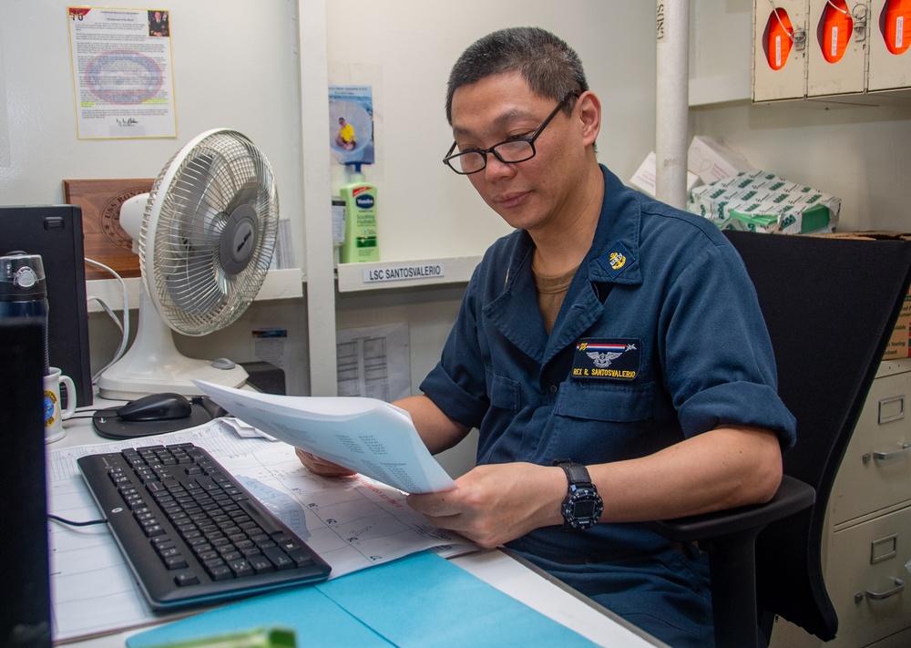 USS Ronald Reagan (CVN 76) supply Sailors conduct daily operations