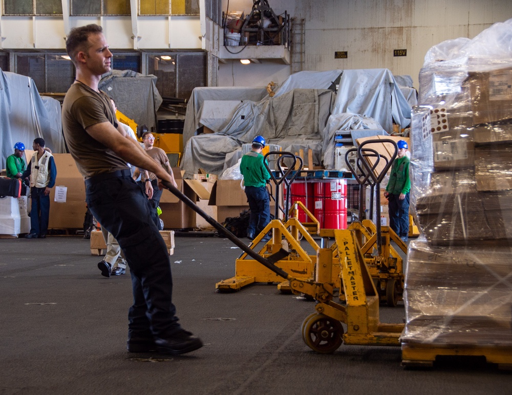 USS Ronald Reagan (CVN 76) conducts replenishment-at-sea with USNS Yukon (T-AO 202) and USNS Carl Brashear (T-AKE 7)