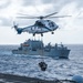 USS Ronald Reagan (CVN 76) conducts replenishment-at-sea with USNS Yukon (T-AO 202) and USNS Carl Brashear (T-AKE 7)