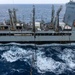 USS Ronald Reagan (CVN 76) conducts replenishment-at-sea with USNS Yukon (T-AO 202) and USNS Carl Brashear (T-AKE 7)