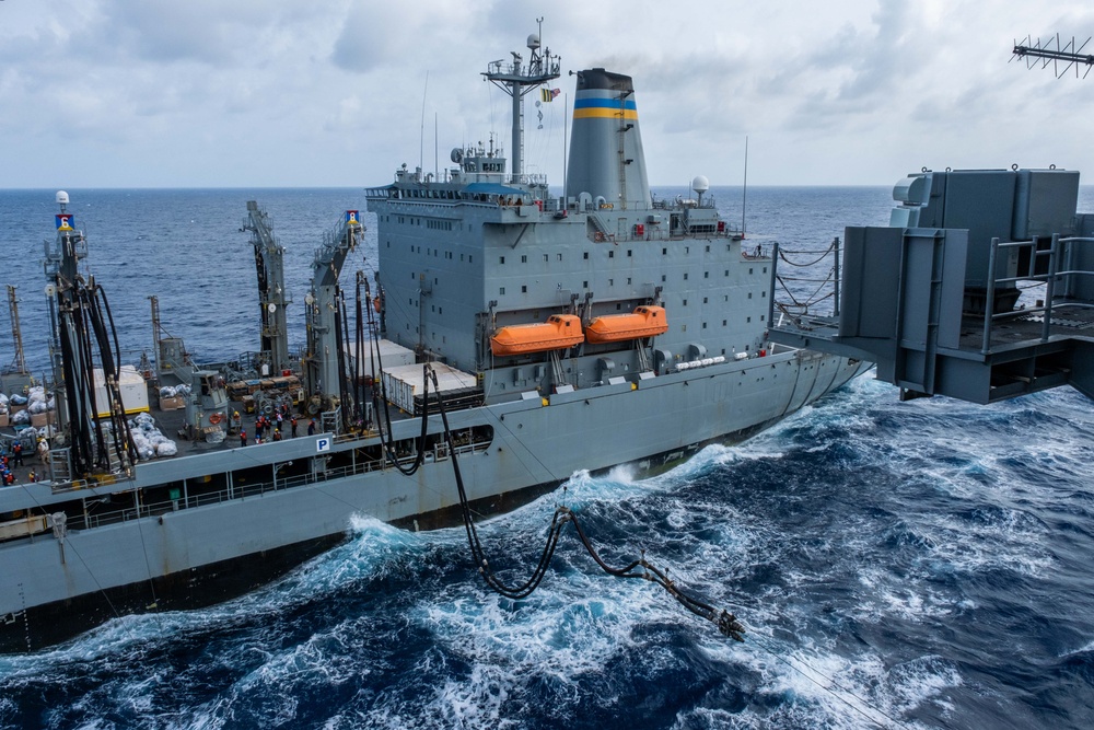 USS Ronald Reagan (CVN 76) conducts replenishment-at-sea with USNS Yukon (T-AO 202) and USNS Carl Brashear (T-AKE 7)