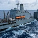 USS Ronald Reagan (CVN 76) conducts replenishment-at-sea with USNS Yukon (T-AO 202) and USNS Carl Brashear (T-AKE 7)