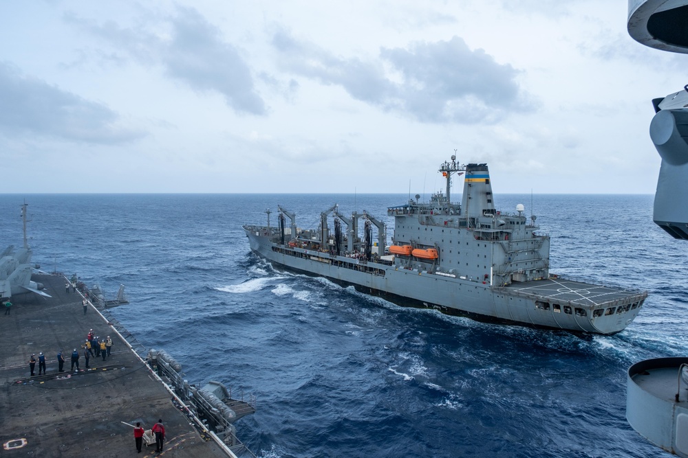 USS Ronald Reagan (CVN 76) conducts replenishment-at-sea with USNS Yukon (T-AO 202) and USNS Carl Brashear (T-AKE 7)