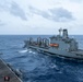 USS Ronald Reagan (CVN 76) conducts replenishment-at-sea with USNS Yukon (T-AO 202) and USNS Carl Brashear (T-AKE 7)