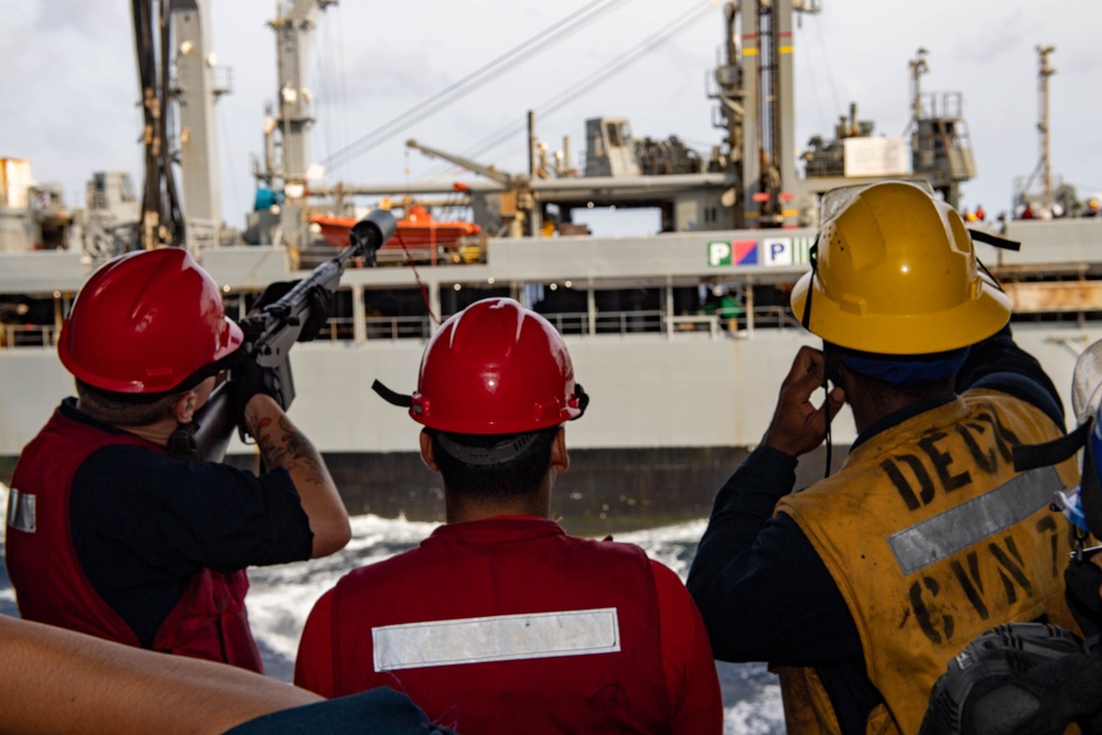USS Ronald Reagan (CVN 76) conducts replenishment-at-sea with USNS Yukon (T-AO 202) and USNS Carl Brashear (T-AKE 7)