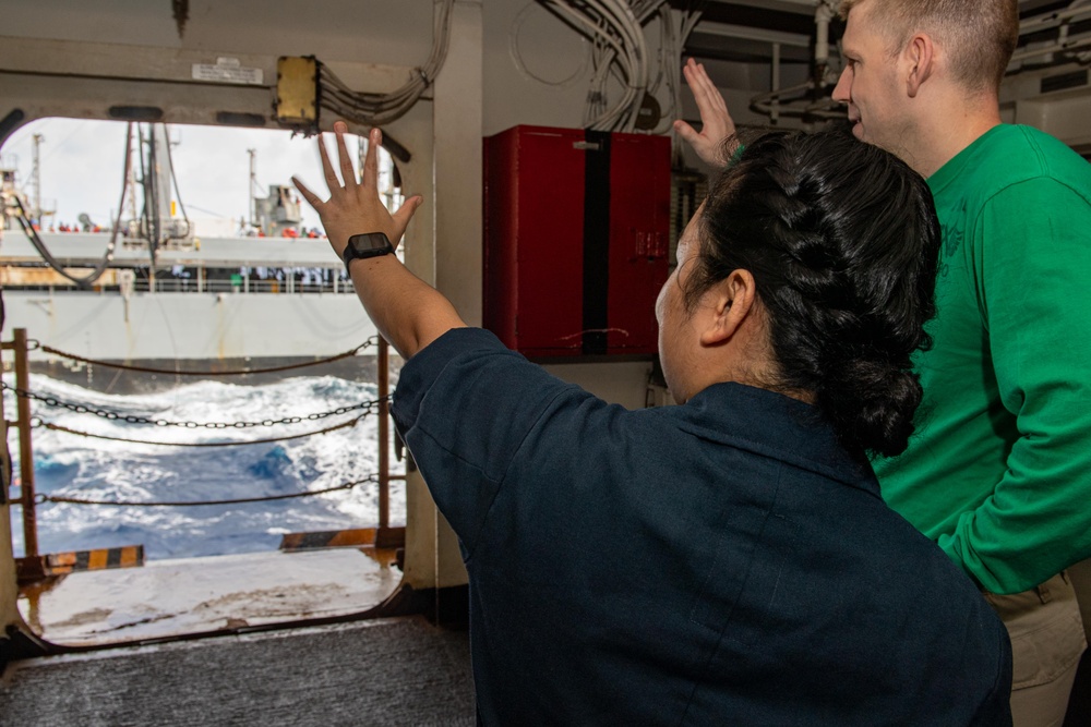 USS Ronald Reagan (CVN 76) conducts replenishment-at-sea with USNS Yukon (T-AO 202) and USNS Carl Brashear (T-AKE 7)