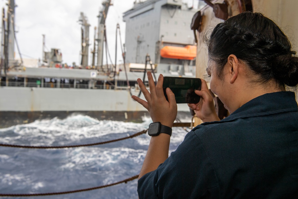 USS Ronald Reagan (CVN 76) conducts replenishment-at-sea with USNS Yukon (T-AO 202) and USNS Carl Brashear (T-AKE 7)