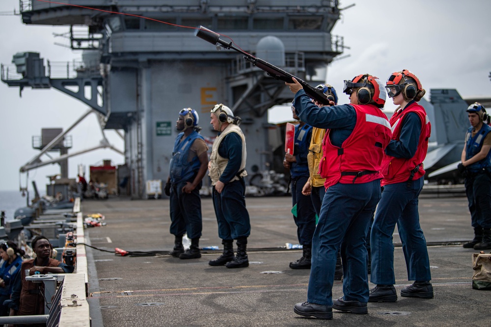 USS Ronald Reagan (CVN 76) conducts replenishment-at-sea with USNS Yukon (T-AO 202) and USNS Carl Brashear (T-AKE 7)