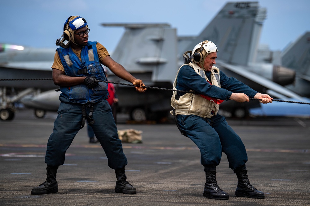 USS Ronald Reagan (CVN 76) conducts replenishment-at-sea with USNS Yukon (T-AO 202) and USNS Carl Brashear (T-AKE 7)