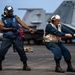 USS Ronald Reagan (CVN 76) conducts replenishment-at-sea with USNS Yukon (T-AO 202) and USNS Carl Brashear (T-AKE 7)
