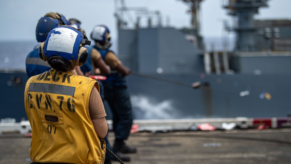 USS Ronald Reagan (CVN 76) conducts replenishment-at-sea with USNS Yukon (T-AO 202) and USNS Carl Brashear (T-AKE 7)