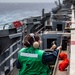 USS Ronald Reagan (CVN 76) conducts replenishment-at-sea with USNS Yukon (T-AO 202) and USNS Carl Brashear (T-AKE 7)